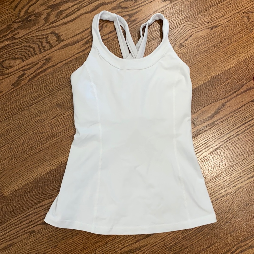 White lululemon tank top. Built in bra. Pads not included. Size 6